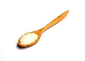 Salt in wooden spoon photo