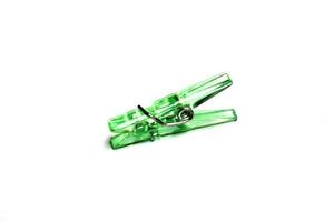 Green clothespin on white photo