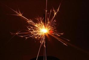 Sparkler close-up at night photo