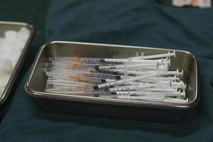 Injection needles in stainless bowl photo