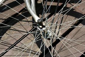 Old bicycle wheel and shadow photo