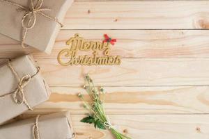 Merry Christmas wood background with gifts and copy space photo