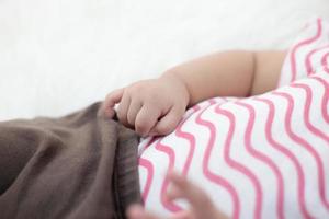 New born baby's hand with selective focus photo