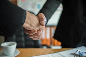 Businessmen shaking hands photo