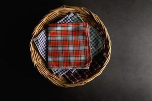 Handkerchiefs placed in a wooden basket photo