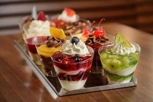 Dessert in cups on a tray photo