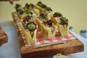 Mini canapes with cheese vegeteble a sausage photo