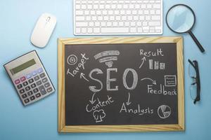 Top view of SEO Search Engine Optimization on black board