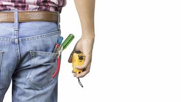 Handy man with tape measure on white background
