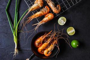 Cooked shrimp on a dark background photo
