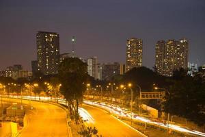 Street and buildings in Singapore at night photo