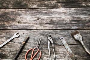 Mechanic tools set on dirty wooden background