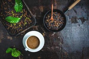 Cup of coffee with roasted coffee beans photo