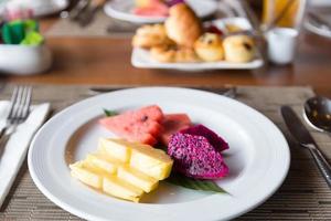 Fruits on white plate photo