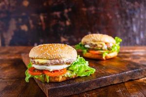 Burgers on a wooden board photo