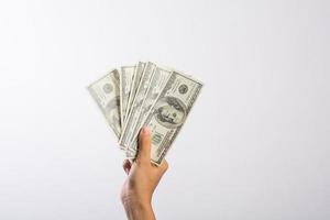 Woman's hand with money isolated on white background photo