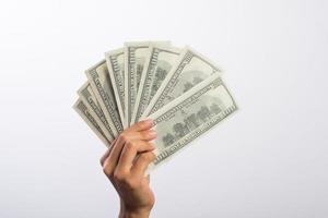 Woman's hand with money isolated on white background photo