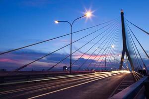 Traffic on the bridge in Bangkok at sunset photo