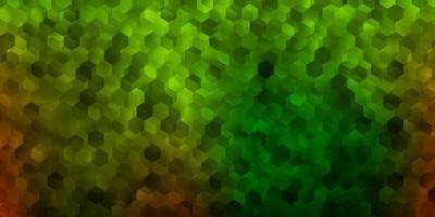 Dark green, yellow vector backdrop with a batch of hexagons.