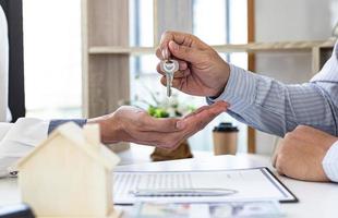 Person handing over keys photo