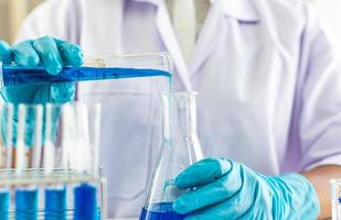 Scientific test tubes with blue liquid photo