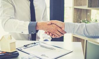 Two people shaking hands photo