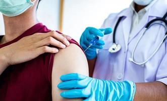 Doctor giving a vaccination photo