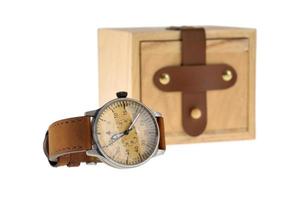 Analog wristwatch with wooden box photo
