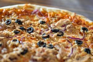 Pizza with olives and sausage photo