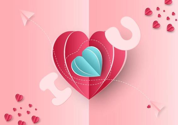 Valentine's day background. Hearts pink and blue paper cut card on blue background. Decor plane with space for text.