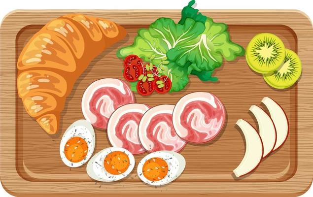 Top view of breakfast set in a cutting board isolated