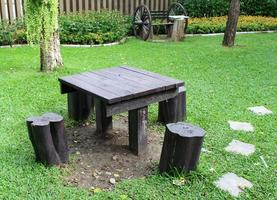 Table and chairs in a park photo