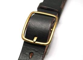 Black leather belt isolated on white photo