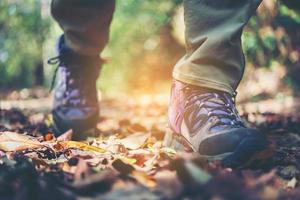 Close-up of hiker's feet walking on a mountain path photo