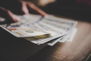 Close-up of businesswoman with cash photo