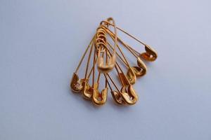 Gold safety pins photo