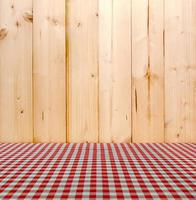 Red tablecloth with wood background photo