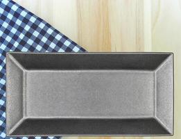 Black tray on blue cloth photo