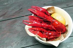 Red crawfish on wood photo