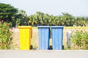 Colorful trash bins on the street photo