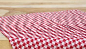 Red checkered tablecloth on table photo