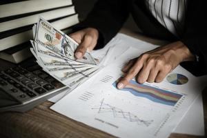 Business person calculating financial growth and investment photo