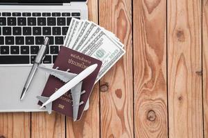 Top view of tourist concept on wood background photo