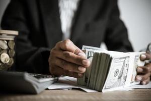 Hands counting dollar banknotes photo