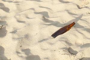 Empty bottle on the beach photo