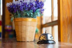 Bell on a wooden table photo