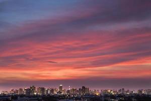 Beautiful sunset above a city photo
