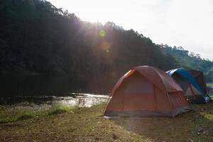 Tents near a stream photo
