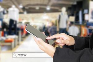 Person using tablet in a store photo