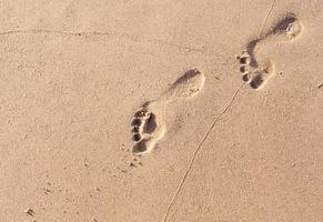 Footprints in sand photo